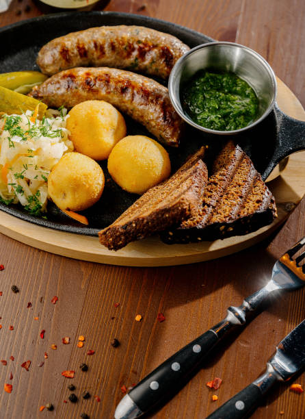 istock Fried potato and bavarian sausage.Top view 1262299037