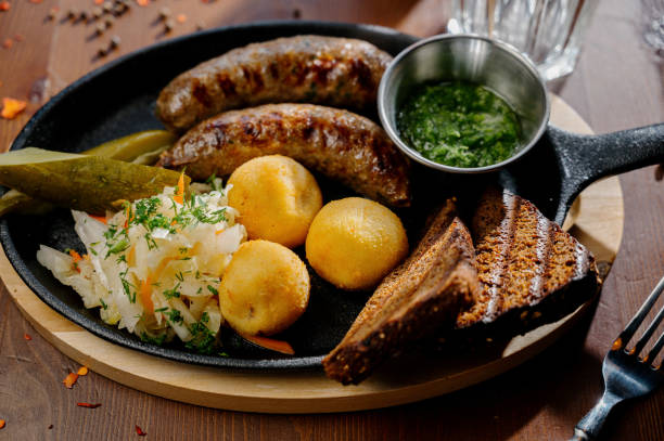 istock Fried potato and bavarian sausage.Top view 1262299050