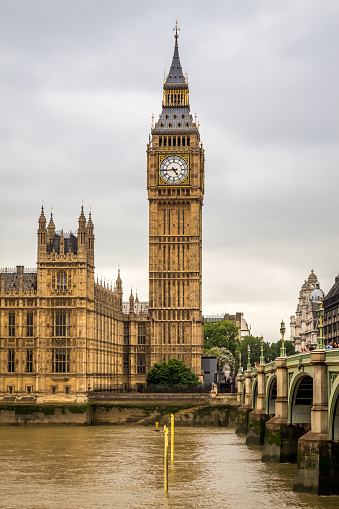 London, United Kingdom - June 24th 2015: Big Ben by Westminster Bridge and the River Thames on a cloudy day in London