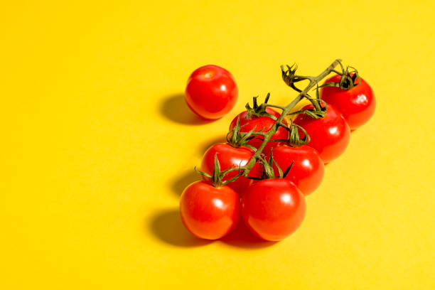 istock Cherry tomato on yellow. Concept. Vegetable. 1262300946