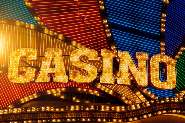 istock Brightly Casino sign and neon lights 1262302107