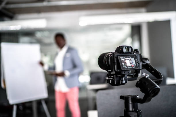istock Businessman recording a video in the office 1262302174