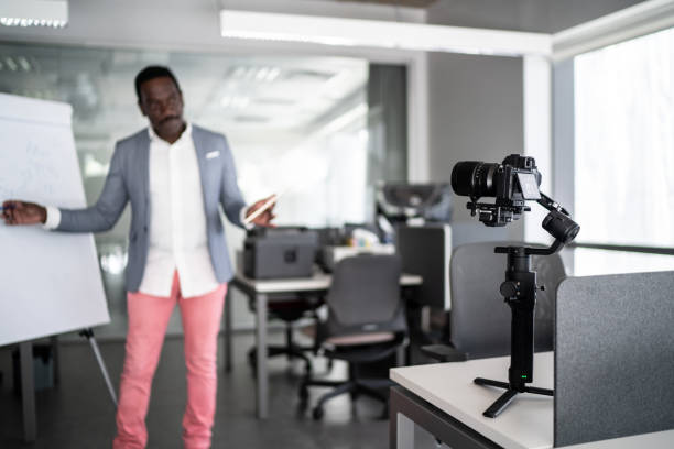 istock Businessman recording a video in the office 1262302191