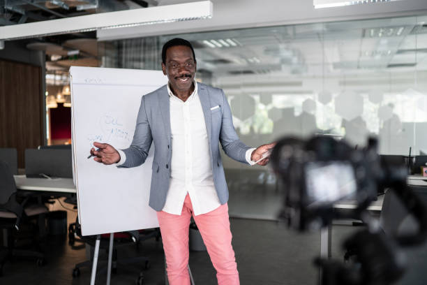 istock Businessman recording a video in the office 1262302204