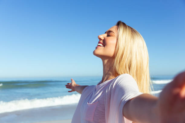 istock Caucasian woman enjoying at beach 1262302551