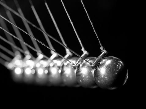 Indoor black and white close up from newton`s cradle.