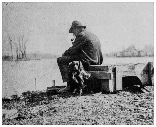 istock Antique black and white photo: Man with dog 1262303666