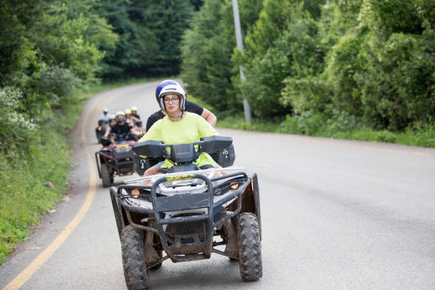 istock Friends in off-road vehicle driving through forest 1262304543