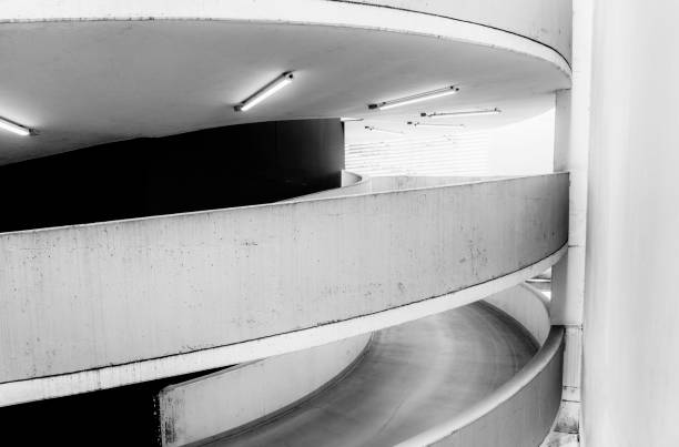 istock Empty underground garage inteior with concrete wall and floor 1262306152