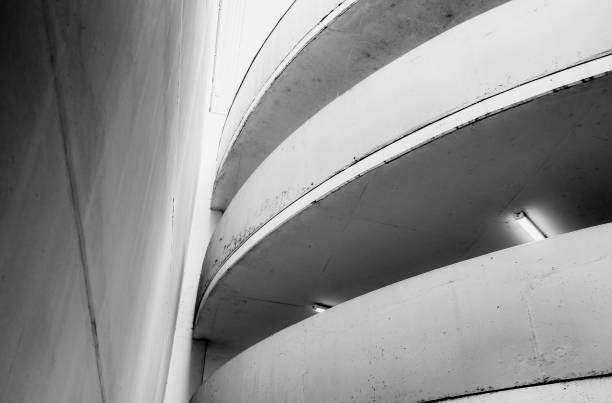 istock Empty underground garage inteior with concrete wall and floor 1262306561