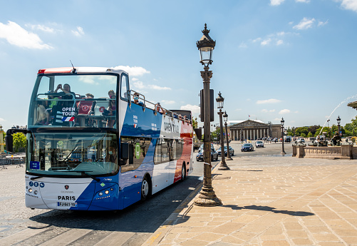 Paris, France. Monday 20 July 2020. People ride on a Tourist tour bus in Paris, France.