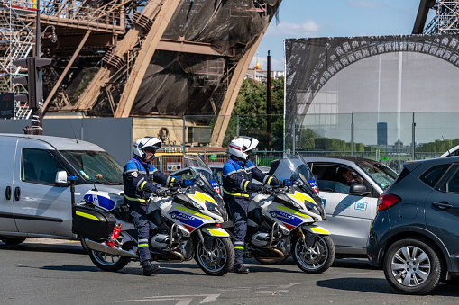 Paris, France. Monday 20 July 2020. Police on motorbikes by the Eiffel Tower in Paris in traffic.