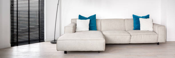 istock Panorama of corner sofa with blue pillows 1262312975