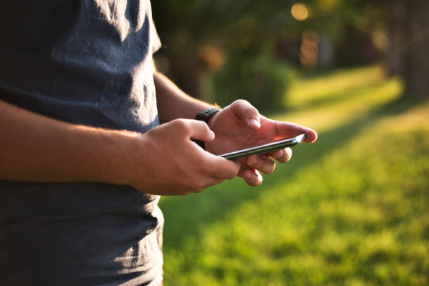 istock Teenage Boy Using Phone In Urban Setting 1262313062