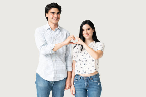 istock Loving Couple Making Heart Shape 1262313083