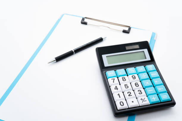 istock Clipboard and calculator on a white background 1262315623
