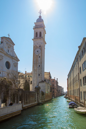 Small canal with Chiesa di San Giorgio dei Greci Church bell tower - campanile, Venice, Italy