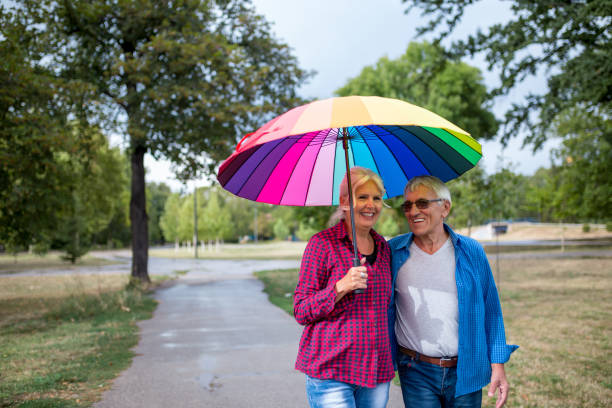 istock Couple walking in wet day 1262316639