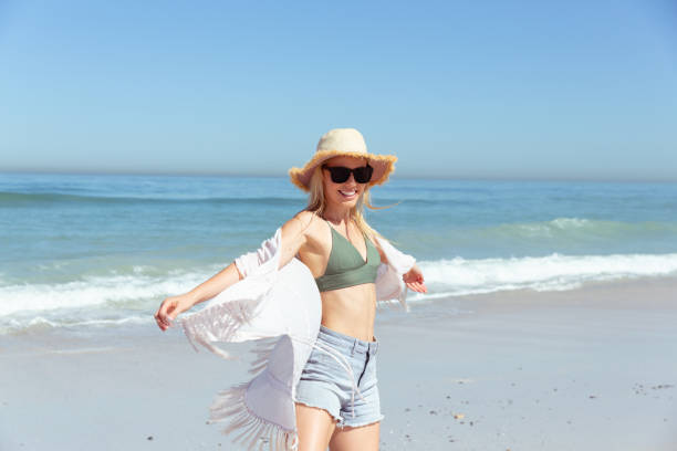 istock Caucasian woman enjoying at beach 1262318969