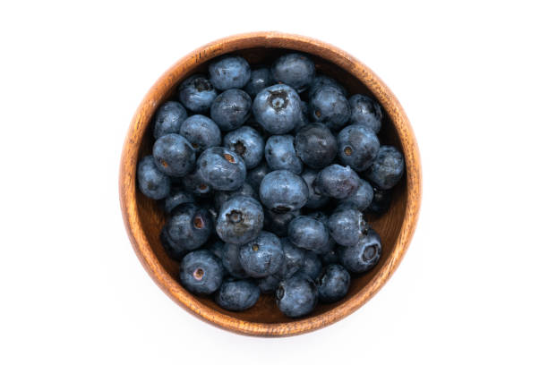 istock Lots of blueberries on a white background 1262330968