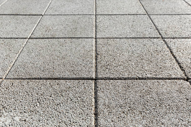 istock Coating with modern textured paving tiles of square shape. 1262337398