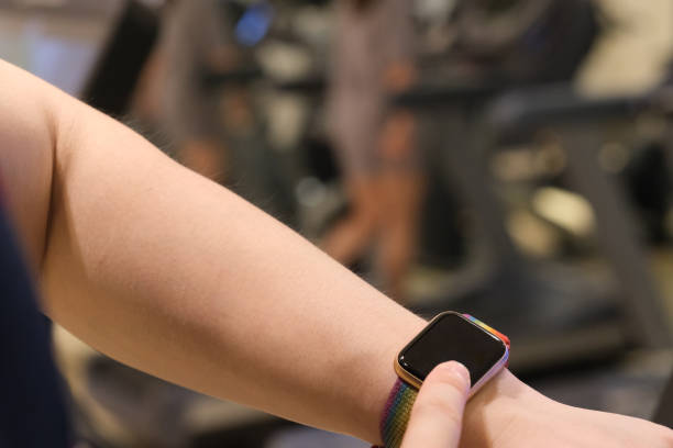 istock close up man's finger touching blank screen smart watch in gym 1262339117