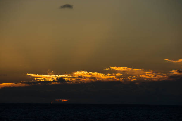 istock Beautiful sunset clouds over the calm sea 1262345335
