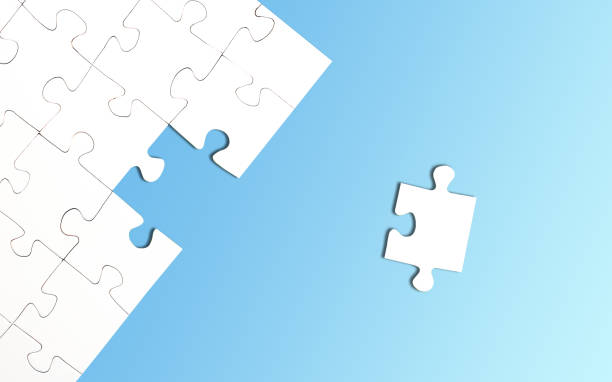 istock top view of jigsaw puzzle with one piece left on green background 1262346094