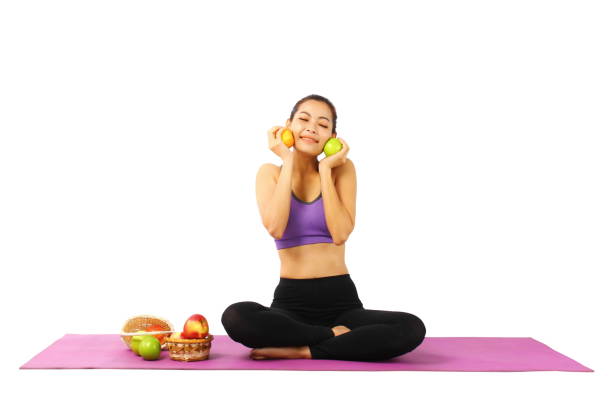 istock young woman with fresh fruit 1262348622