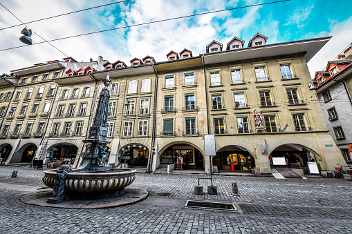 Beautiful Fountain On Street Full Of Market Vendors In Bern, Switzerland