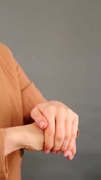 istock a young woman who is rubbing her hands 1262357062