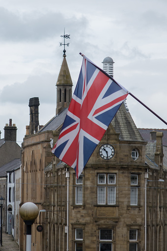 Clitheroe town centre in the Ribble Valley with a union jack flying in the wind