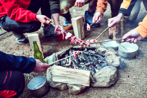 istock Barbecue On Sticks And Beer For Forest Campers 1262360305