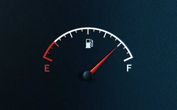 Photo of Fuel Gauge's Red Needle Indicating Full Gas Tank on Black Background