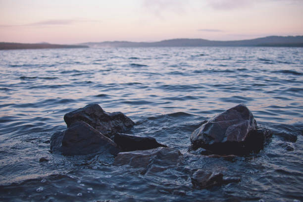 istock Rocks in lake Zyuratkul water 1262376315