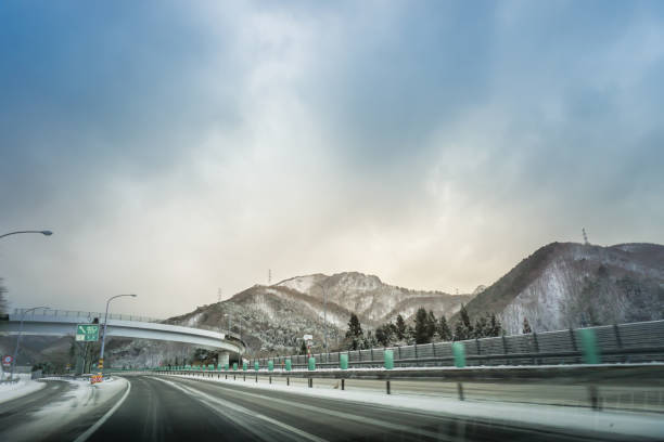 Japanese highway through snow mountain in winter.