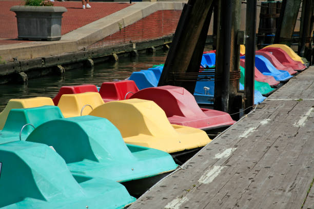 istock Colorful pedal boats on water 1262377059