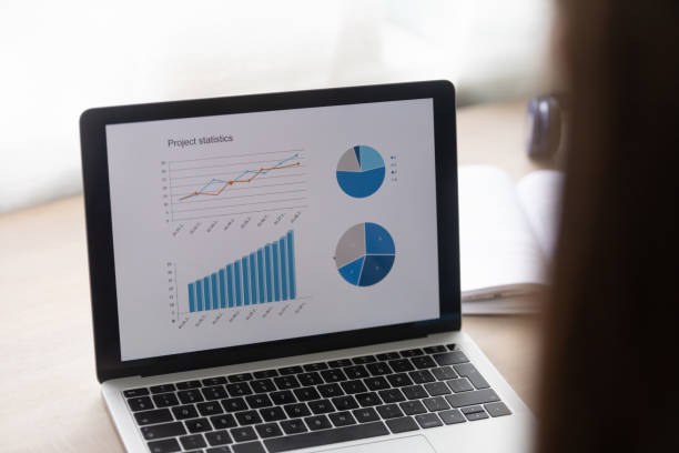 istock Close up of laptop with financial graphs on screen 1262378679