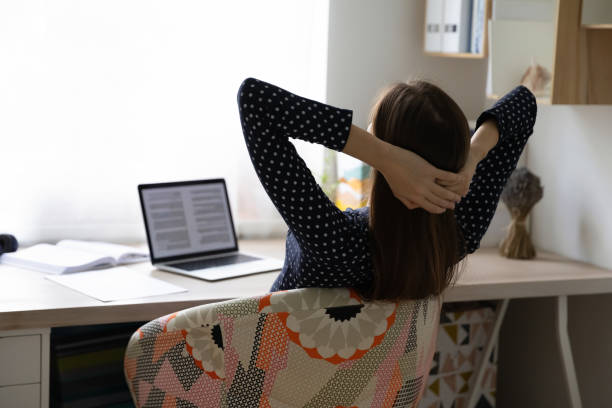 istock Back view of relaxed woman resting at workplace 1262378689