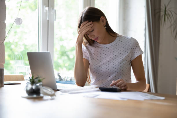 istock Frustrated young woman distressed by financial budget problems 1262378727