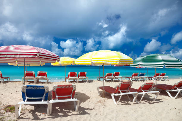 lounge chairs and umbrellas on the beach at Mullet Bay, St.Martin, dutch west indies