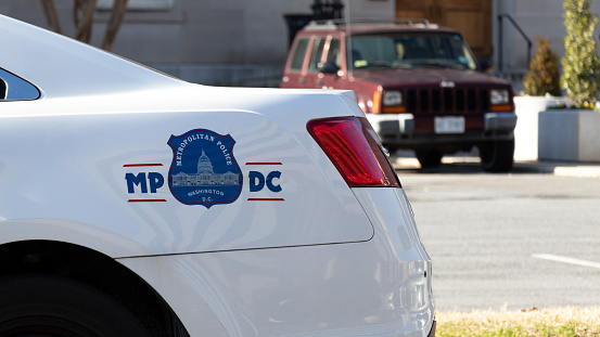 Seal of the Metropolitan Police Department of the District of Columbia (Metro PD) on the side of police cruiser in downtown Washington.