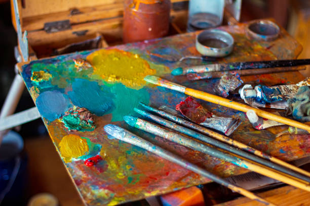 istock Colorful artist's palette with oil paints in studio 1262388649