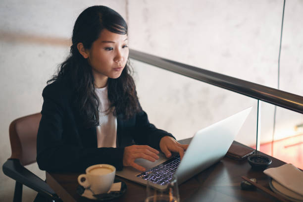 istock Young businesswoman working at restaurant 1262390270