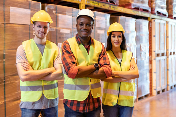 istock Black warehouse supervisor manager with white caucasian team 1262390375