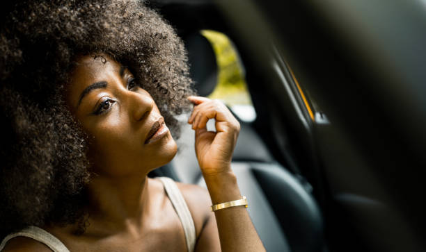 istock Young black woman inside the car 1262390432