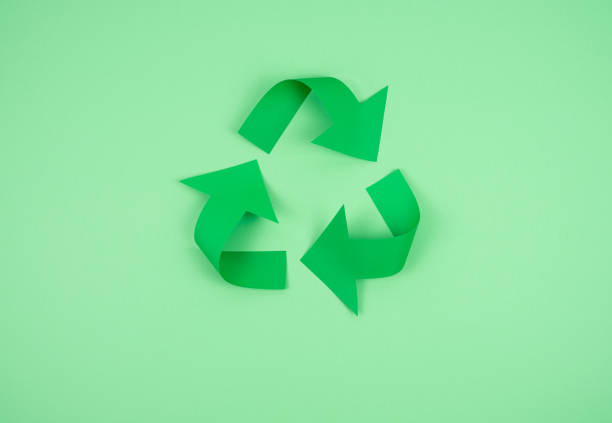 istock Recycling logo on green paper. Recycling concept. 1262392581