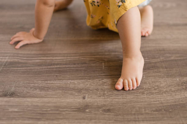 istock 16-Month-Old Girl's Toes & Hands While Eating & Playing 1262396431