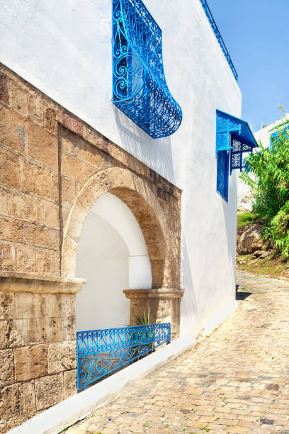 istock Arch on white and blue city street 1262396489
