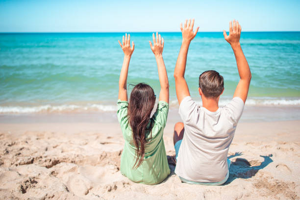 istock Young couple on white beach during summer vacation. 1262397400